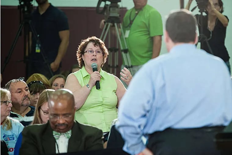 At the meeting in Haddon Heights, Gov. Christie takes a question from the audience. Among topics at the event, Christie reiterated that he would veto tax increases Democrats were advancing as part of their budget proposal. (Matthew Hall/Staff)