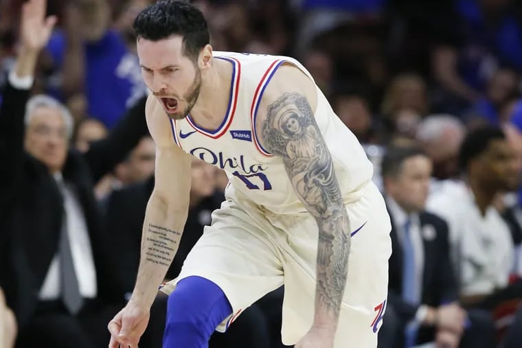 Sixers guard JJ Redick celebrates a three-point basket against the Heat during the fourth quarter of the Sixers’ win on Saturday.