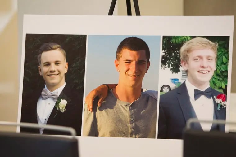 Photos of three of Cosmo DiNardo's victims (from left) Jimi Tar Patrick, Dean A. Finocchiaro, and Thomas C. Meo, rest behind their families and lawyers at a March 5, 2018, press conference in Philadelphia. The cable network Investigation Discovery is planning a two-part special on the case, called "The Lost Boys of Bucks County."