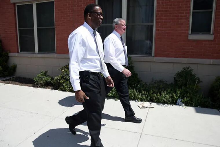 Jim Kenney (back) tours North Philadelphia neighborhoods with Council President Darrell Clarke on May 2, 2015. ( DAVID MAIALETTI / Staff Photographer )