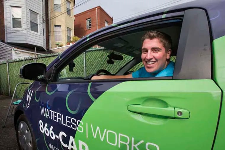 Christopher Caporale shown here with his waterless car cleaning solution vehicle, November 04, 2014. Staff Photographer / Jessica Griffin