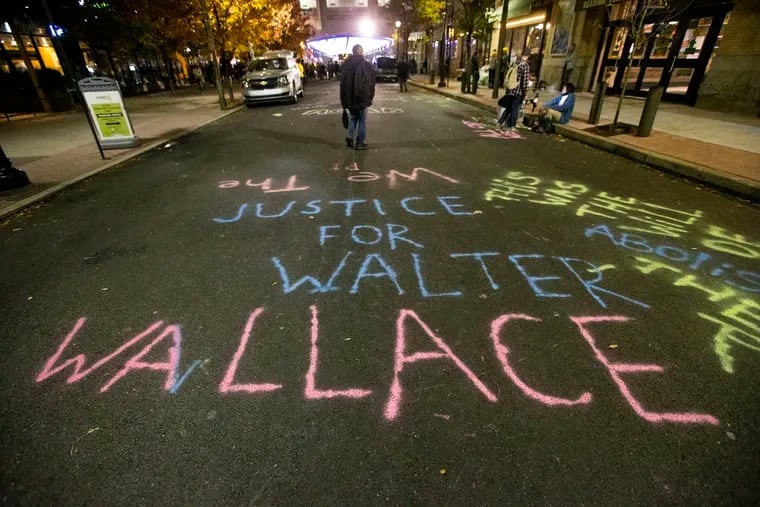 A memorial message for Walter Wallace, Jr., a Black Philadelphian who was shot and killed by police, on 12th St. below the start of "We the people," ahead of Wallace's funeral Nov. 7, 2020. Protests around Wallace's death added to a groundswell movement for racial justice last year.