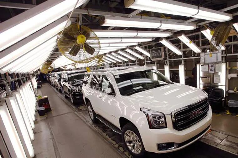 GMC SUVs roll through one of many quality checks at the General Motors Assembly Plant in Arlington, Texas, on November 25, 2014. (Louis DeLuca/Dallas Morning News/TNS)