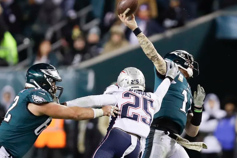After Lane Johnson left the game with concussion symptoms, Carson Wentz was under duress for the rest of the night.