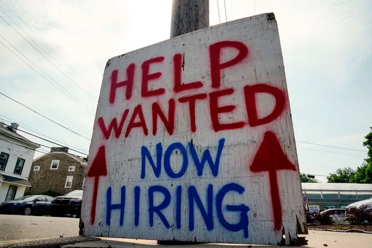 A help wanted sign is posted outside of business in Philadelphia last June. After nearly three years, Pennsylvania has returned to the employment level it had before the COVID-19 pandemic caused a sharp and unexpected drop-off. The state lost 1.1 million jobs in March and April 2020. As of January, more than 100% of those jobs had been recovered, the Pennsylvania Department of Labor and Industry announced Friday.