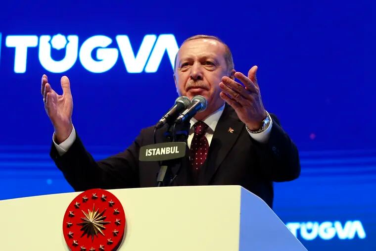 Turkey's President Recep Tayyip Erdogan addresses a meeting of a youth organisation founded by his elder son Bilal Erdogan and his friends, in Istanbul Saturday, Dec. 22, 2018. Erdogan said Friday the United States decided to withdraw troops from Syria after he reassured U.S. President Donald Trump that Turkey could eradicate the remnants of Islamic State group from the country with logistical help from Washington.(Presidential Press Service via AP, Pool)
