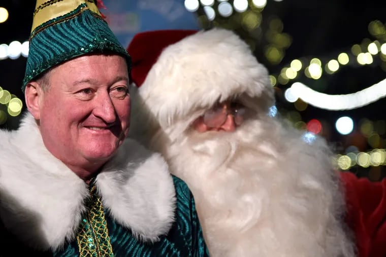 Mayor Kenney makes his annual holiday appearance as Buddy the Elf, with Councilman Mark Squilla as Santa Claus.