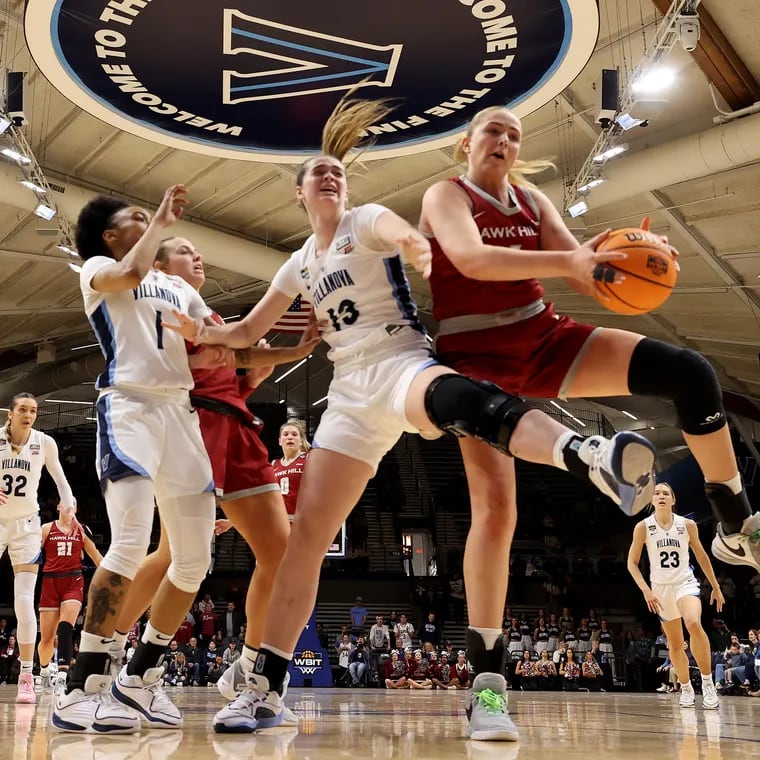 Brynn McCurry, center, of Villanova and Laura Ziegler of St. Joseph's go after the ball in a quarterfinal WBIT game on March 28, 2024 at the Finneran Pavilion at Villanova University.