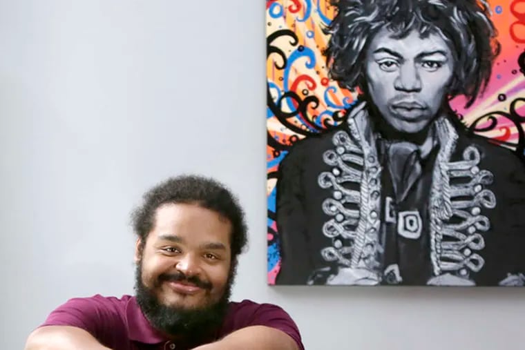 In his Old City apartment , Andrew &quot;Pop&quot; Wansel kicks back with an image of one of his heroes, Jimi Hendrix. He has produced some of the hottest acts in music, including Nicki Minaj's latest album.