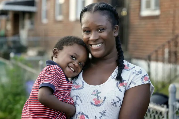Stephanie Chapman and her son, Momo, then 1. Working and going to school, Chapman still finds the economy daunting.