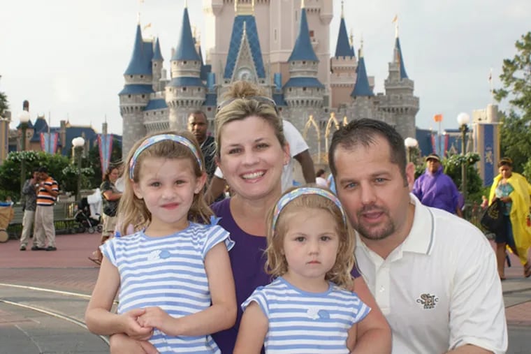 Carrie Goretzka, who was killed by a downed power line, at Disney World with daughters Chloe (left) and Carlie and husband, Michael. The utility agreed to a $105 million settlement last week.