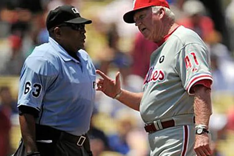 Charlie Manuel argues with the umpire during the Phillies' win over the Dodgers on Wednesday. (Mark J. Terrill/AP)