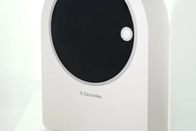 E-Wash, a compact washing machine that uses soap nuts instead of detergent, garnered the top prize for Levente Szab&#0243; of Hungary in the Electrolux Design Lab competition. At right is finalist Nature Wind, by Bae Won-Ho of South Korea. The solar-powered air cleaner uses a series of filters.