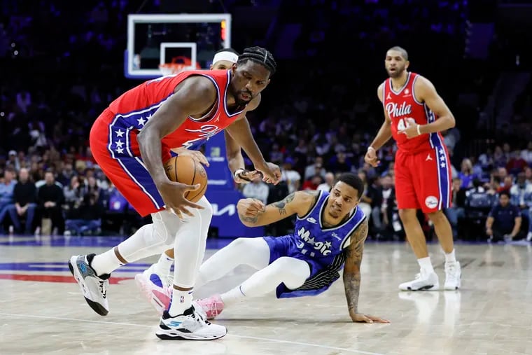 Joel Embiid (left) scored 32 points in the Sixers win over the Magic.