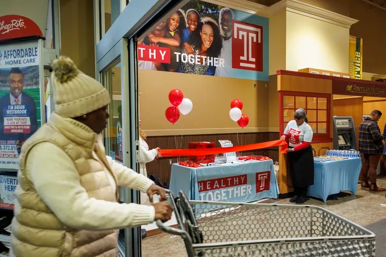 A Shoprite customer enters the chain's Fox Street location in Nicetown during the grand opening celebration for the new Healthy Together Hub on Tuesday, Dec. 5. Temple Health and Brown’s Super Stores partnered to open the free clinic, which will offer regular health screenings to the public and connect patients to additional care.