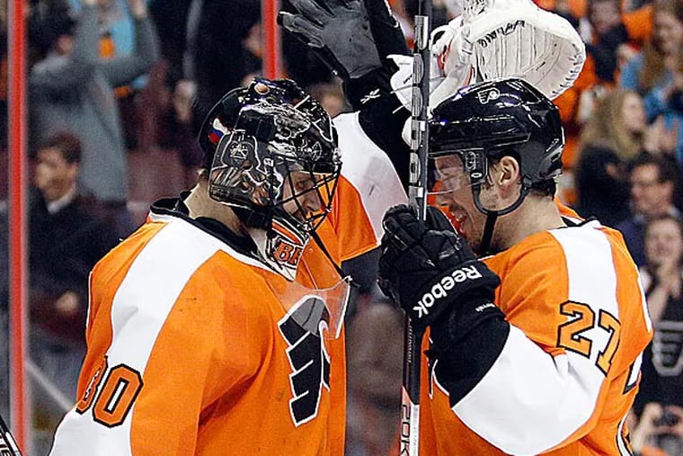 Flyers goalie Ilya Bryzgalov and teammate Bruno Gervais celebrate a win over the Montreal Canadiens. (Yong Kim/Staff Photographer)