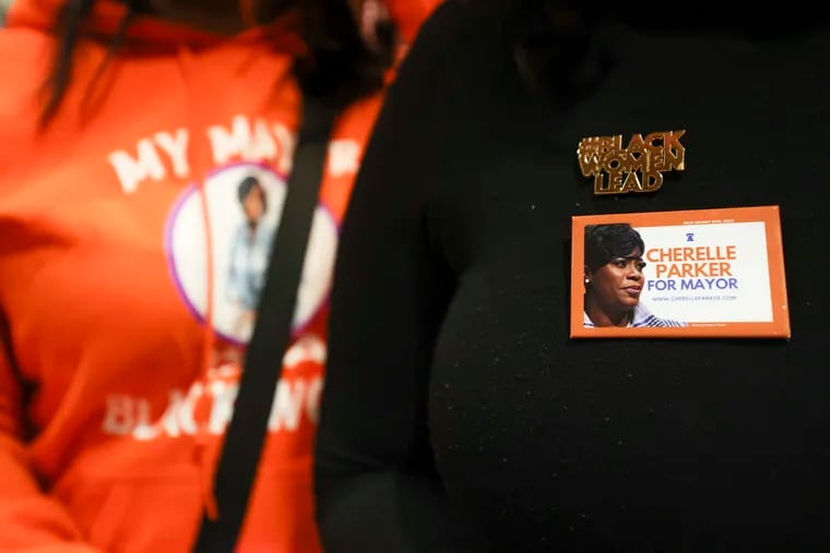 A guest wears a “Black Women Lead” pin at Cherelle Parker’s election night party at the Sheet Metal Workers Local 19 headquarters in South Philadelphia on Tuesday.