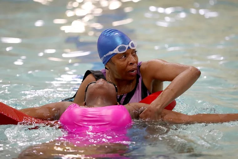 Robin Borlandoe, 70, who was a city lifeguard in her teens, works with  partner, Jaelynn Edwards, as they take the certification class at Friends Select School pool in Philadelphia, Pa. on Sunday, May 22, 2022.