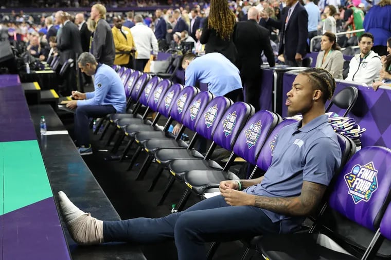 Justin Moore of Villanova, who tore his Achilles tendon in the regional final victory over Houston  was unable to play in the ational semifinal against Kansas in the NCAA Tournament on  April 2, 2022 at the Superdome in New Orleans.