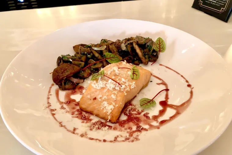 Pan-seared salmon with wild mushroom, horseradish, and red wine is on the Center City District Restaurant Week menu at Rouge.