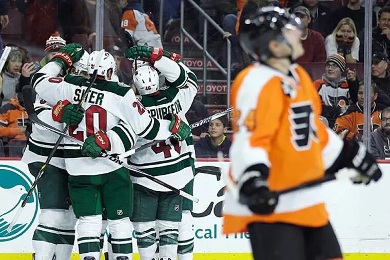 Minnesota Wild players celebrate after the go-ahead goal by Jason Zucker during the third period of an NHL hockey game against the Philadelphia Flyers, Thursday, Nov. 20, 2014, in Philadelphia. Minnesota won 3-2. (Matt Slocum/AP)