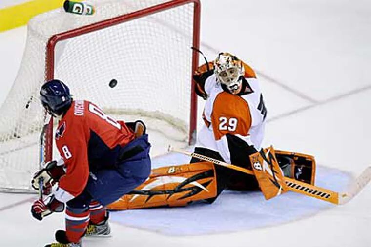 The Capitals' Alex Ovechkin (8) scores a goal on a penalty shot against Flyers goalie Ray Emery (29). (AP Photo/Nick Wass)