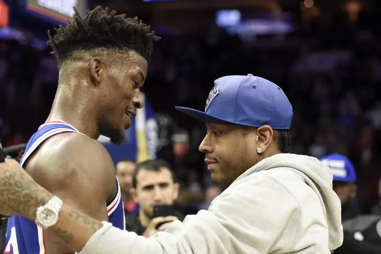 Jimmy Butler, left, talks to Allen Iverson after the game against the Suns.