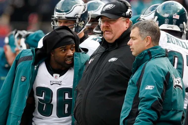 The Eagles&#0039; Brian Westbrook talks with coach Andy Reid in the game against the Giants. Reid let Westbrook loose Sunday, and the running back delivered with 131 yards on 33 carries.