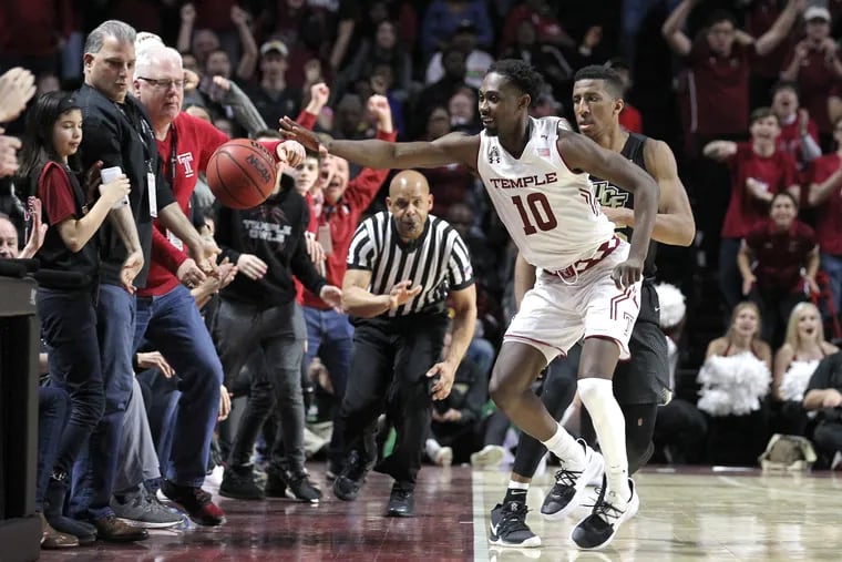 Shizz Alston tries to save the ball from going out-of-bounds during Temple's win on Saturday.