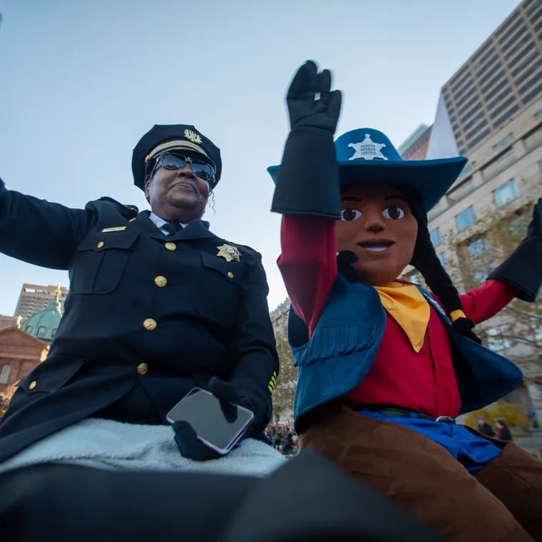 Sheriff Rochelle Bilal rides next to Deputy Sheriff Justice during the 2023 Thanksgiving Day Parade. The mascot suit was part of off-budget purchases made by the sheriff's office in apparent violation of the city's Home Rule Charter.