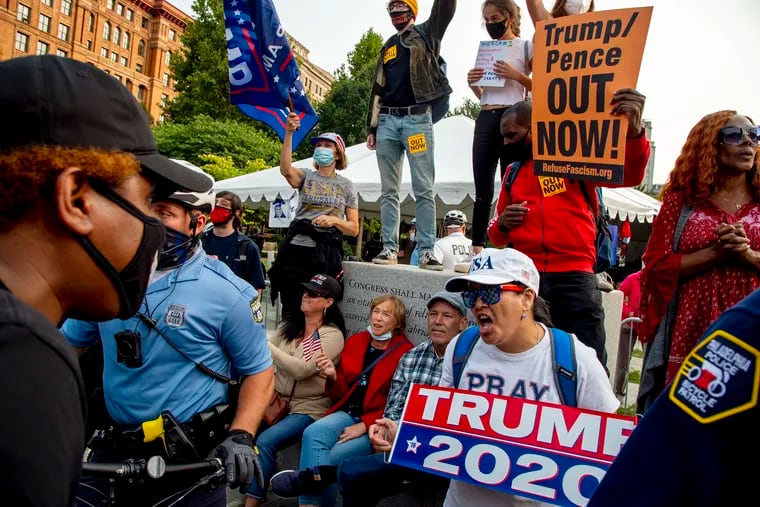 Trump supporters and protesters confront each other on Independence Mall, across from the National Constitution Center, where President Trump is inside taping an ABC News Town Hall.