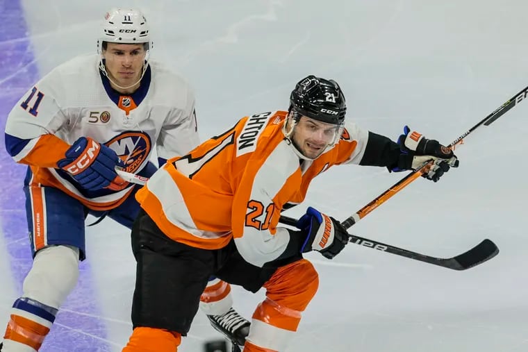 Flyers Scott Laughton skates past Islanders Zach Parise during the second period at the Wells Fargo Center in Philadelphia, Monday, February 6, 2023.