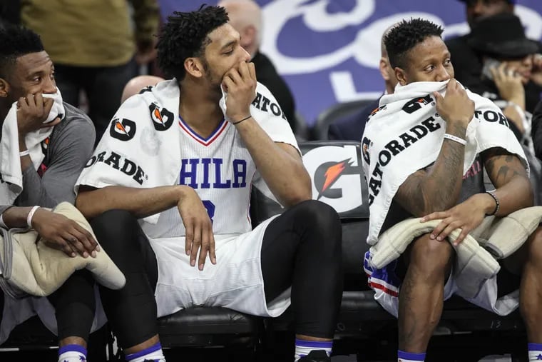 The Sixers' Robert Covington, right, was a member of the team that lost 28 straight games to set an NBA record.