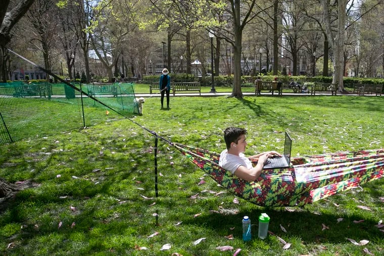 Travis Gunville, 22, lounges on a hammock in Rittenhouse Square Park in Philadelphia one day last month, practicing social distancing amid the coronavirus (COVID-19) outbreak.
