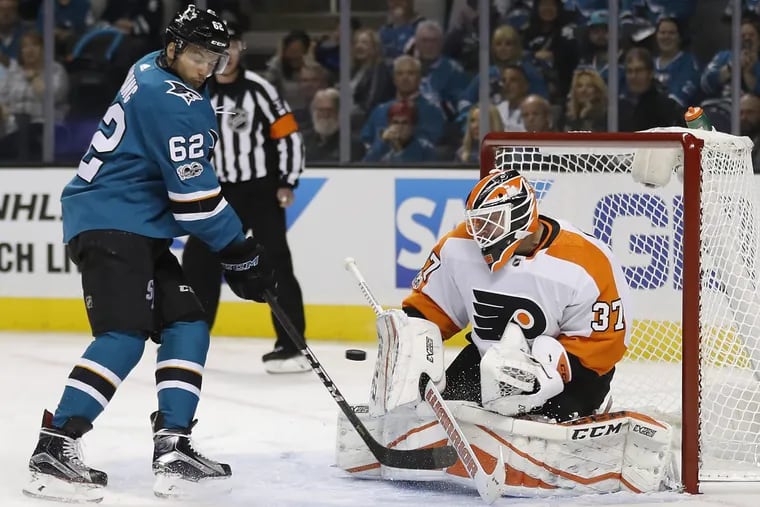 Flyers goalie Brian Elliott denies the Sharks’ Kevin Labanc (62) during the first period  Wednesday night.