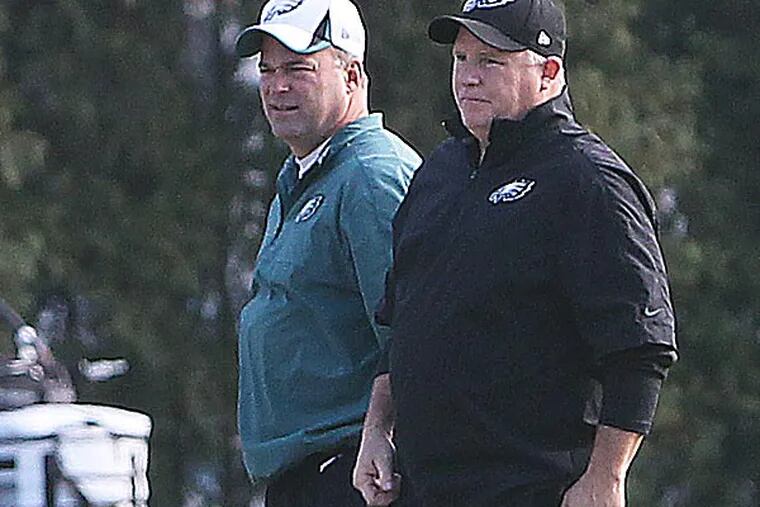 Eagles defensive coordinator Bill Davis and head coach Chip Kelly. (David Maialetti/Staff Photographer)