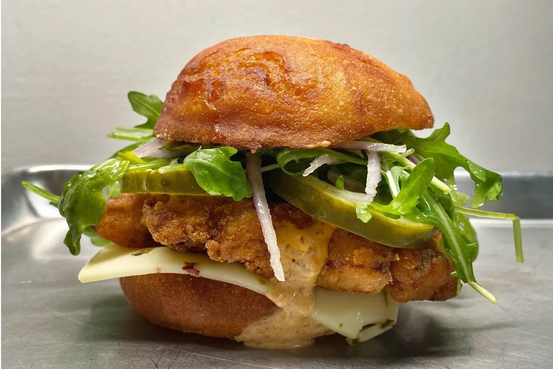 The fried chicken sandwich at Okie Dokie Donuts is entirely gluten-free, from the sour cream- and spice-marinated chicken thighs fried in a rice flour-potato starch crust, to the unglazed doughnut bun. 