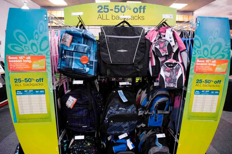 At a Staples in New York, discounted backpacks are on display. Staples is offering a $10 discount card good for 15 percent off on school supplies.