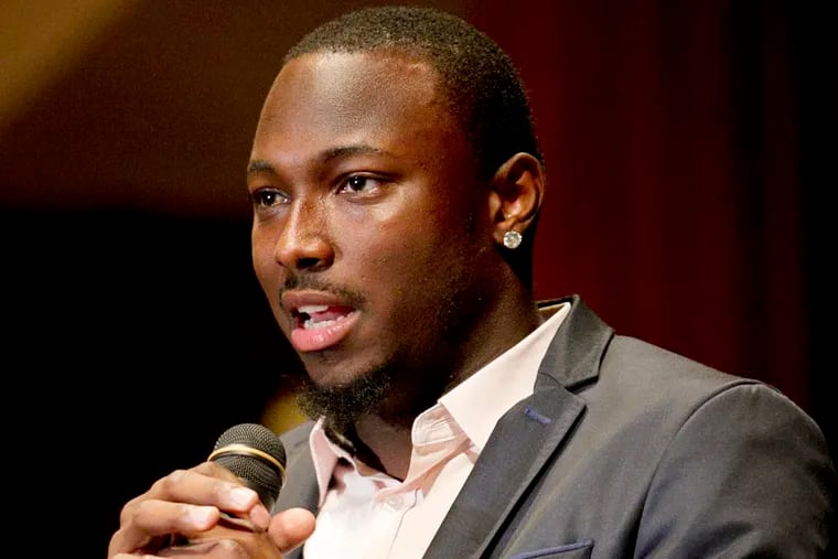 Philadelphia Eagle LeSean McCoy speaks to the audience after receiving an award for his record 2013 season.