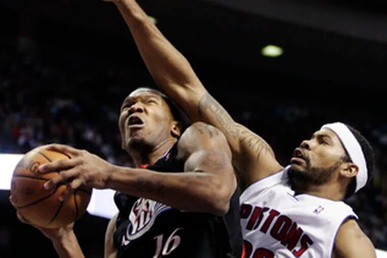 Sixers rookie Marreese Speights, playing in place of injured Elton Brand, drives against the Pistons&#0039; Rasheed Wallace.