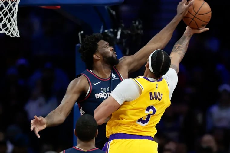 Sixers center Joel Embiid blocks Los Angeles Lakers forward Anthony Davis’ second quarter lay-up attempt on Monday, November 27, 2023 in Philadelphia.