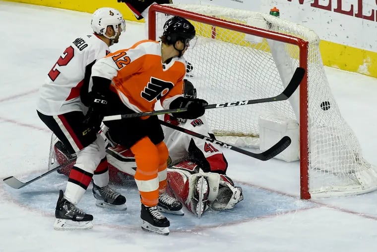 Michael Raffl  (12) scoring the Flyers' second goal Monday, against Ottawa goalie Craig Anderson.