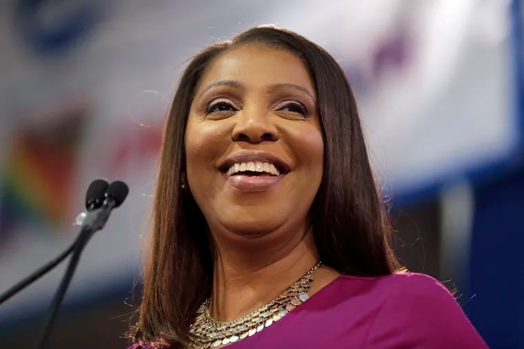 FILE- In this Sunday, Jan. 6, 2019, file photo, New York Attorney Letitia James smiles during an inauguration ceremony in New York.  Newly inaugurated state attorneys general, like James, said they plan to continue investigations of clergy abuse in the Roman Catholic church as victims reach out to state hotlines and online systems to report past abuse.(AP Photo/Seth Wenig)
