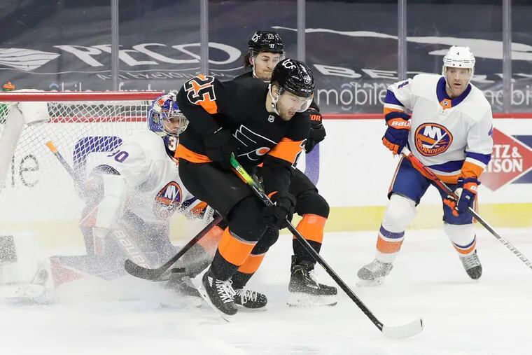 Flyers left winger James van Riemsdyk (foreground), battling in front of the net against the New York Islanders last season, is available to Seattle in the expansion draft.