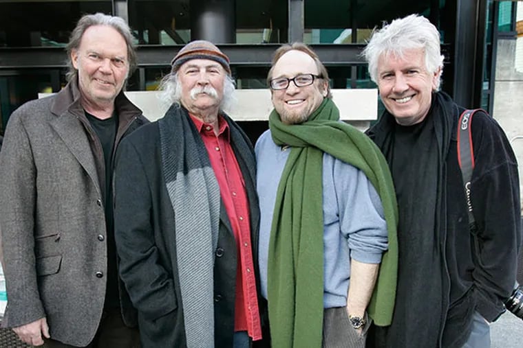 Neil Young, left, David Crosby,second left, Stephen Stills, and Graham Nash, right, pose for a photograph before the premiere of their film "CSNY Deja Vu" at the Sundance Film Festival in Park City, Utah, in this Jan. 25, 2008 file photo. (AP Photo/Amy Sancetta, File)