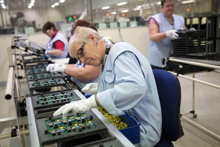 Employees add components to printed circuit boards for six Raspberry Pi single-board computers on the production line at Sony Corp.'s technology center in Pencoed, Wales. Raspberry Pi, a low-cost computer designed primarily for children, was developed in the computer laboratory of the University of Cambridge.
