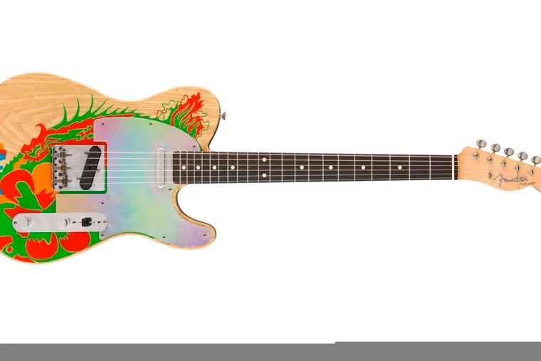 This image released by Fender shows a recreation of a Telecaster guitar that Jimmy Page once painted with a dragon, a long-lost piece of six-string history that marked the guitar hero’s last days in the Yardbirds and first days in Led Zeppelin. Fender craftsman Paul Waller, who worked with Page to reboot the dragon, says it represents “a pivotal moment for the guitar and for music.”
