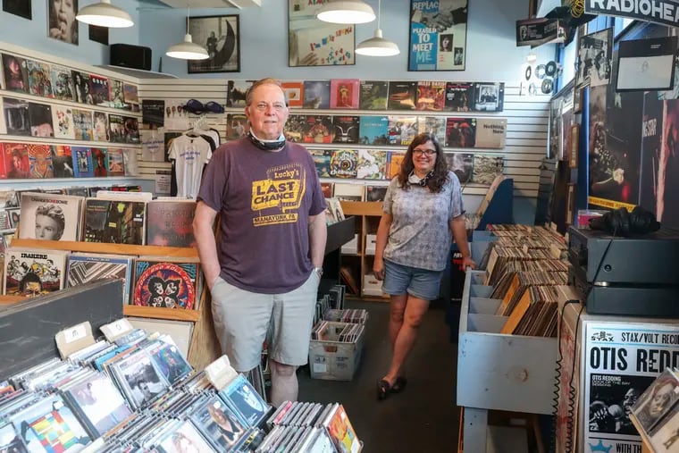 Owner Pat Feeney and longtime employee Jamie Blood at Main Street Music in Manayunk, which is preparing to reopen June 5.