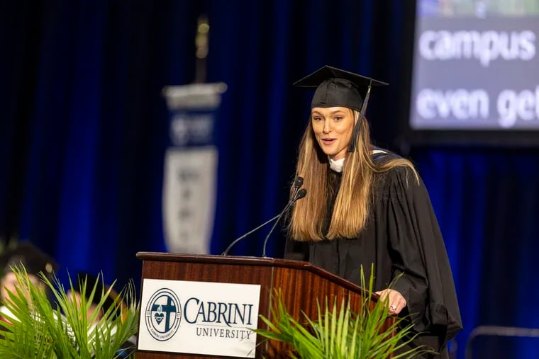 Kylie Kelce, wife of former Eagles center Jason Kelce and a 2017 Cabrini alumna, speaks at Cabrini University's final commencement.
