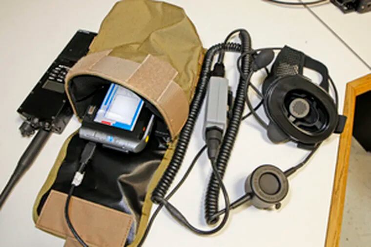 WIRE with its field pack includes microphone and headset (right), monitor and main computer, and radio.